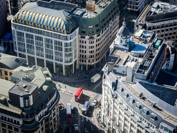 High angle view of red double-decker bus at road intersection in london