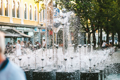 Fountain against trees during winter