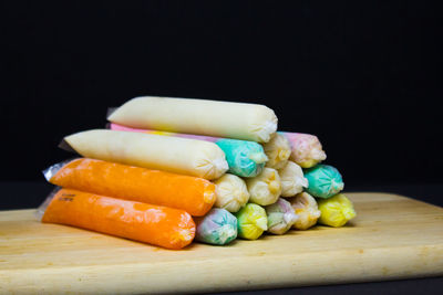 Close-up of multi colored candies on table