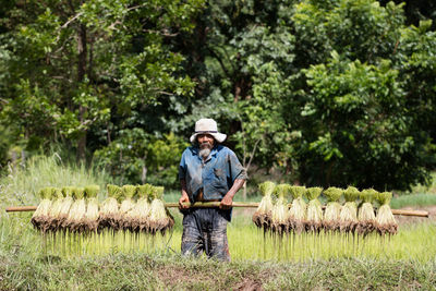 Full length of man standing in farm