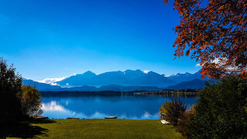 View of calm lake against mountain range