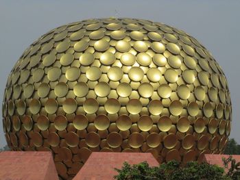 Low angle view of illuminated lighting equipment against sky
