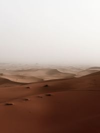 Scenic view of desert against clear sky