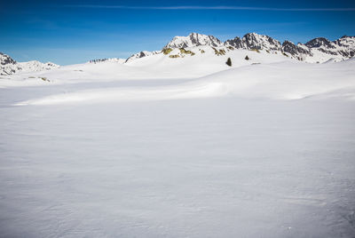 Scenic view of snow covered mountains against sky in alpe d'huez in france