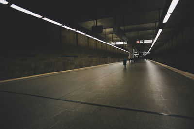 Illuminated subway station at night