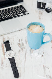High angle view of coffee cup on table