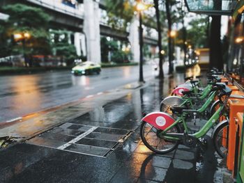 Bicycle on wet road in city during rainy season