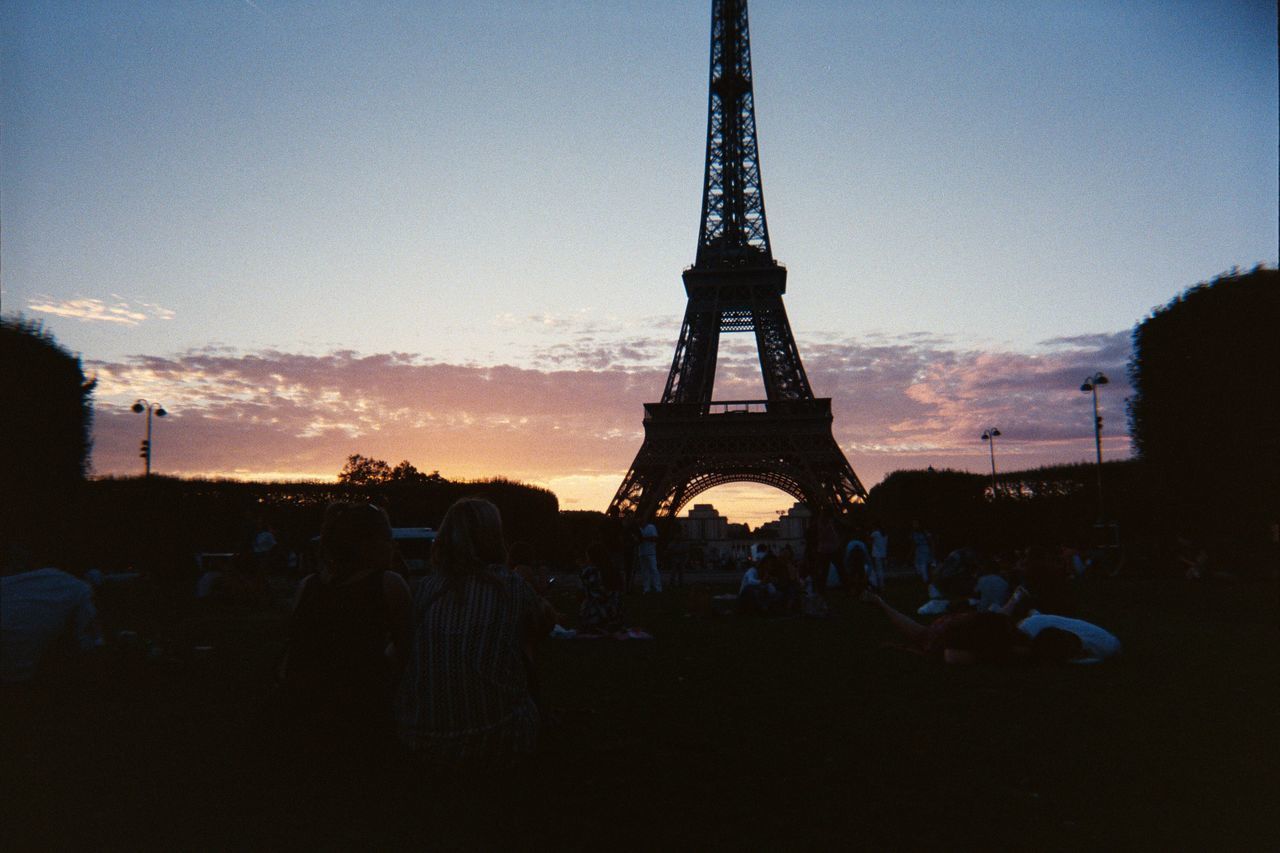 SILHOUETTE OF PEOPLE ON TOWER