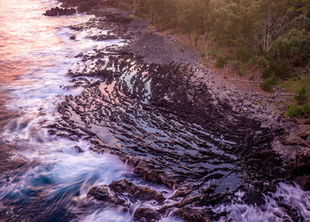 High angle view of water flowing through rocks