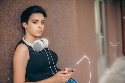 Portrait of mid adult woman using mobile phone