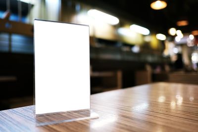 Close-up of blank placard on table