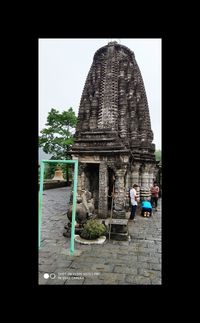 View of temple against building