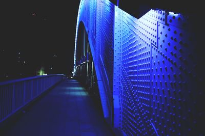 Illuminated footbridge at night