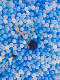 High angle view of man with blue ball