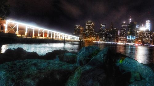 Bridge over river at night