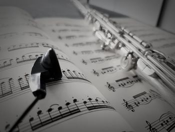 Close-up of sheet music with musical equipment