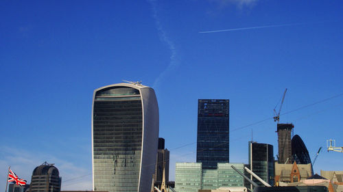 Low angle view of skyscrapers against clear sky