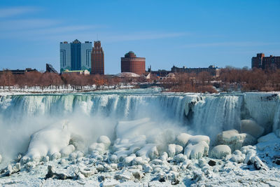 Scenic view of river in city