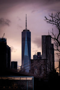 Buildings in city at sunset