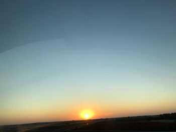 Scenic view of silhouette landscape against clear sky during sunset