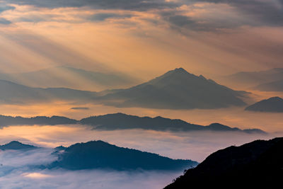 Scenic view of mountains against sky during sunset