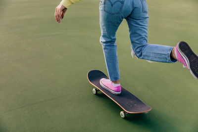 Low section of man skateboarding on skateboard