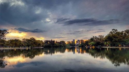 Scenic view of lake against cloudy sky