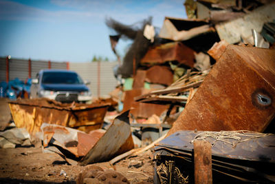 Close-up of abandoned car and leaves