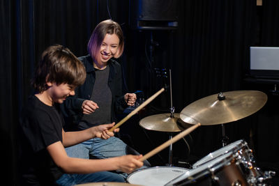 Boy playing drum at home