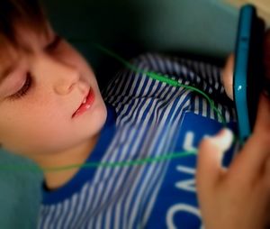 Close-up of boy wearing camera