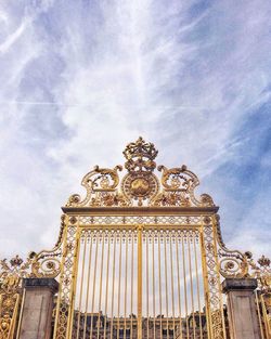 Low angle view of historical building against cloudy sky