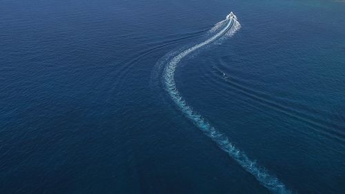 High angle view of ship sailing in sea