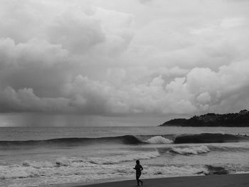 Scenic view of sea against cloudy sky