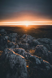 Scenic view of rock formation against sky during sunset