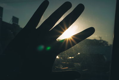 Close-up of silhouette hand against