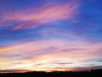 Low angle view of dramatic sky during sunset