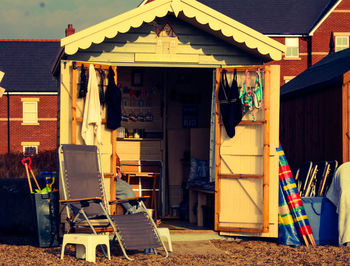 Chairs outside house against building