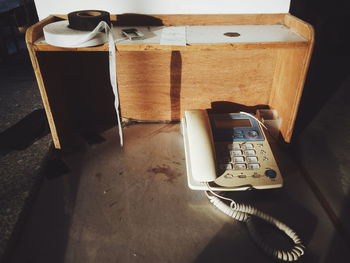 Close-up of telephone booth on table