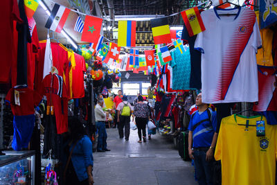 People walking on street market in city