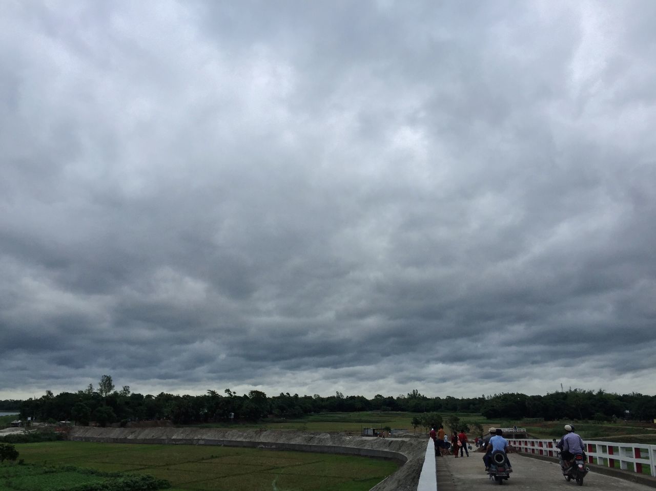 sky, cloud - sky, cloudy, transportation, road, weather, overcast, cloud, land vehicle, nature, car, landscape, mode of transport, tree, scenics, beauty in nature, day, tranquil scene, storm cloud