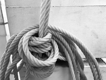 Close-up of rope tied on wood