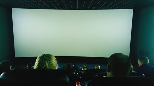 Rear view of audience at movie theater