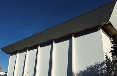 Low angle view of building against blue sky