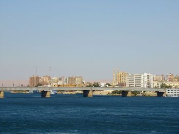 View of buildings in city against clear sky