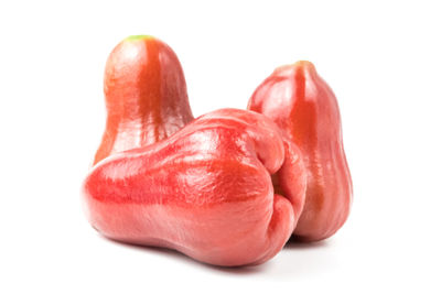 Close-up of strawberry over white background