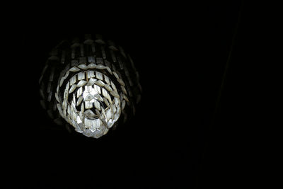 Low angle view of illuminated electric lamp