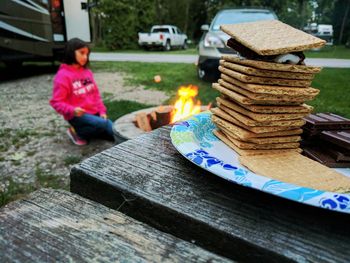 Close-up of crackers in plate on table at backyard