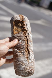 Close-up of hand holding ice cream cone