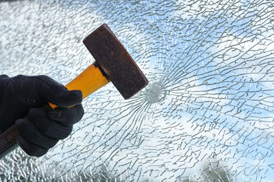 Cropped hand of man holding knife