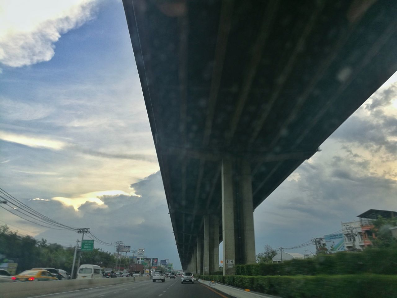 BRIDGE OVER ROAD AGAINST SKY